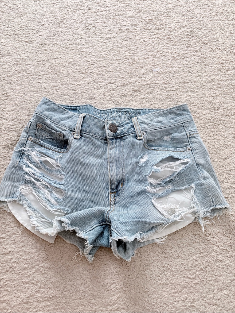 High-Rise Light Blue Distressed Denim Shorts